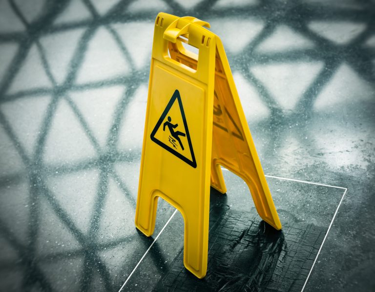 A yellow warning sign "slippery "